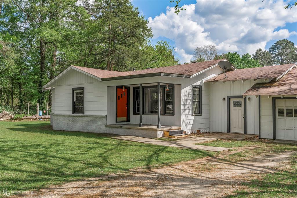 5725 Harper Road Keithville, LA 71047 - Photo 4 of 35 a front view of a house with a yard
