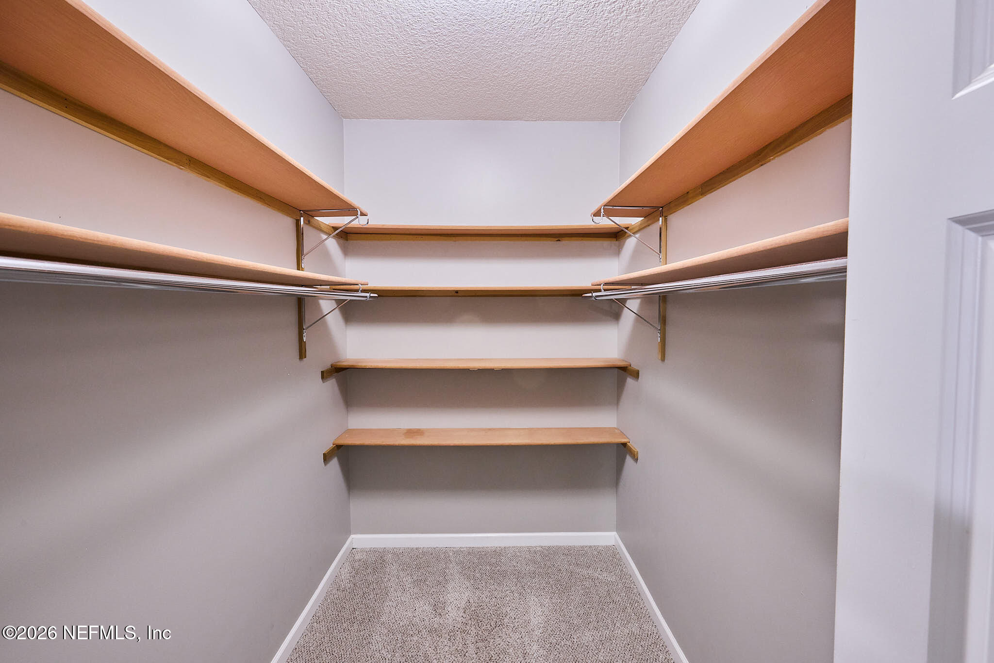 85404 Burmeister Road Fernandina Beach, FL 32034 - Photo 43 of 53 a view of walk in closet with empty racks