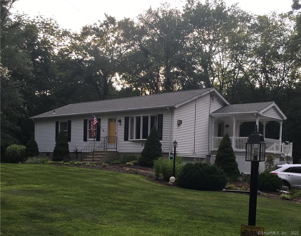 48 Mathewson Mill Road Preston, CT 06365 - Photo 1 of 1 a front view of a house with a garden