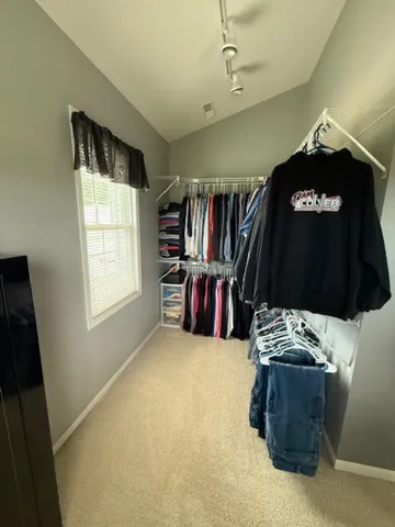 a view of a livingroom with furniture and rack