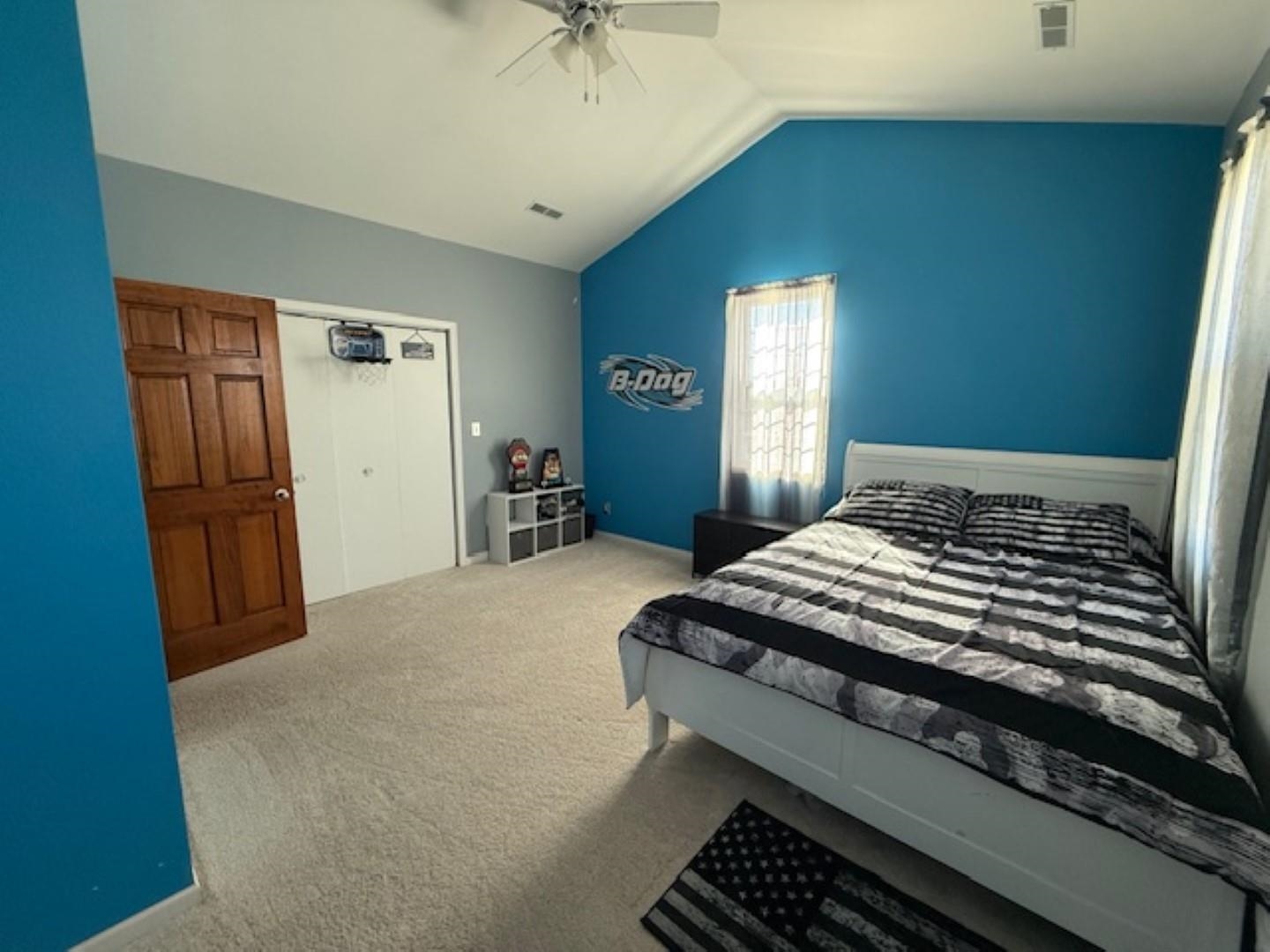 312 East Buckeye Road Dakota, IL 61018 - Photo 20 of 38 a bedroom with a bed and a chandelier