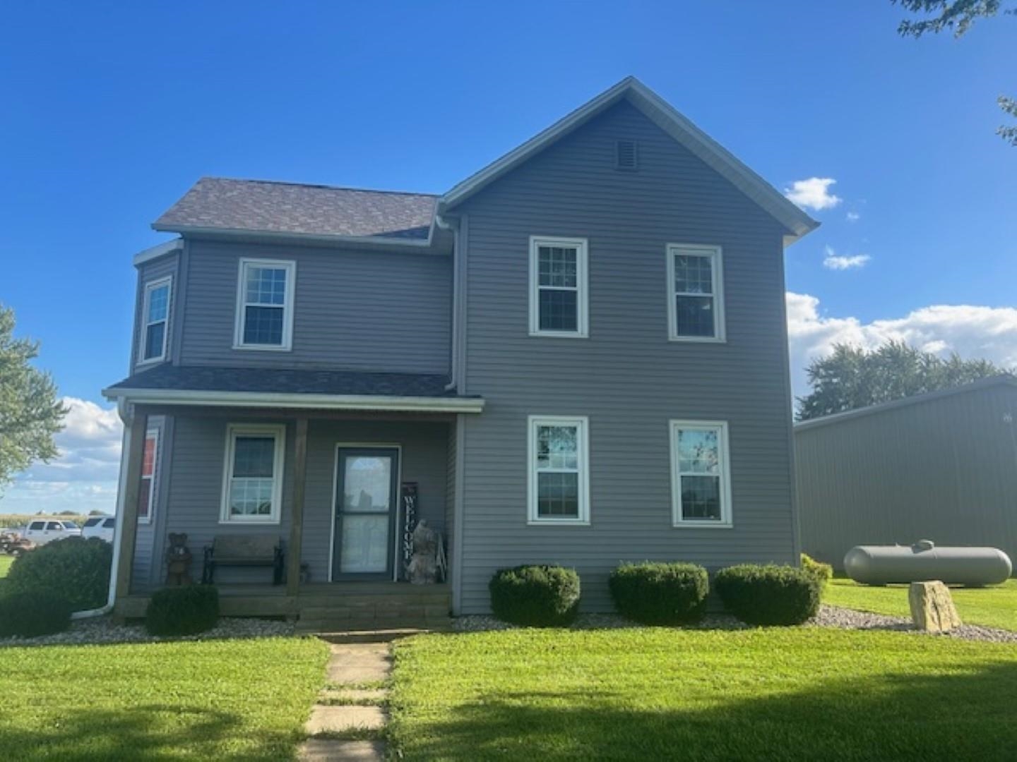 312 East Buckeye Road Dakota, IL 61018 - Photo 2 of 38 a front view of a house with a yard
