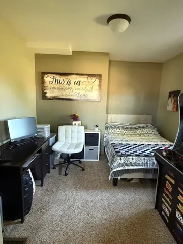 a outdoor space with blue wall and toilet