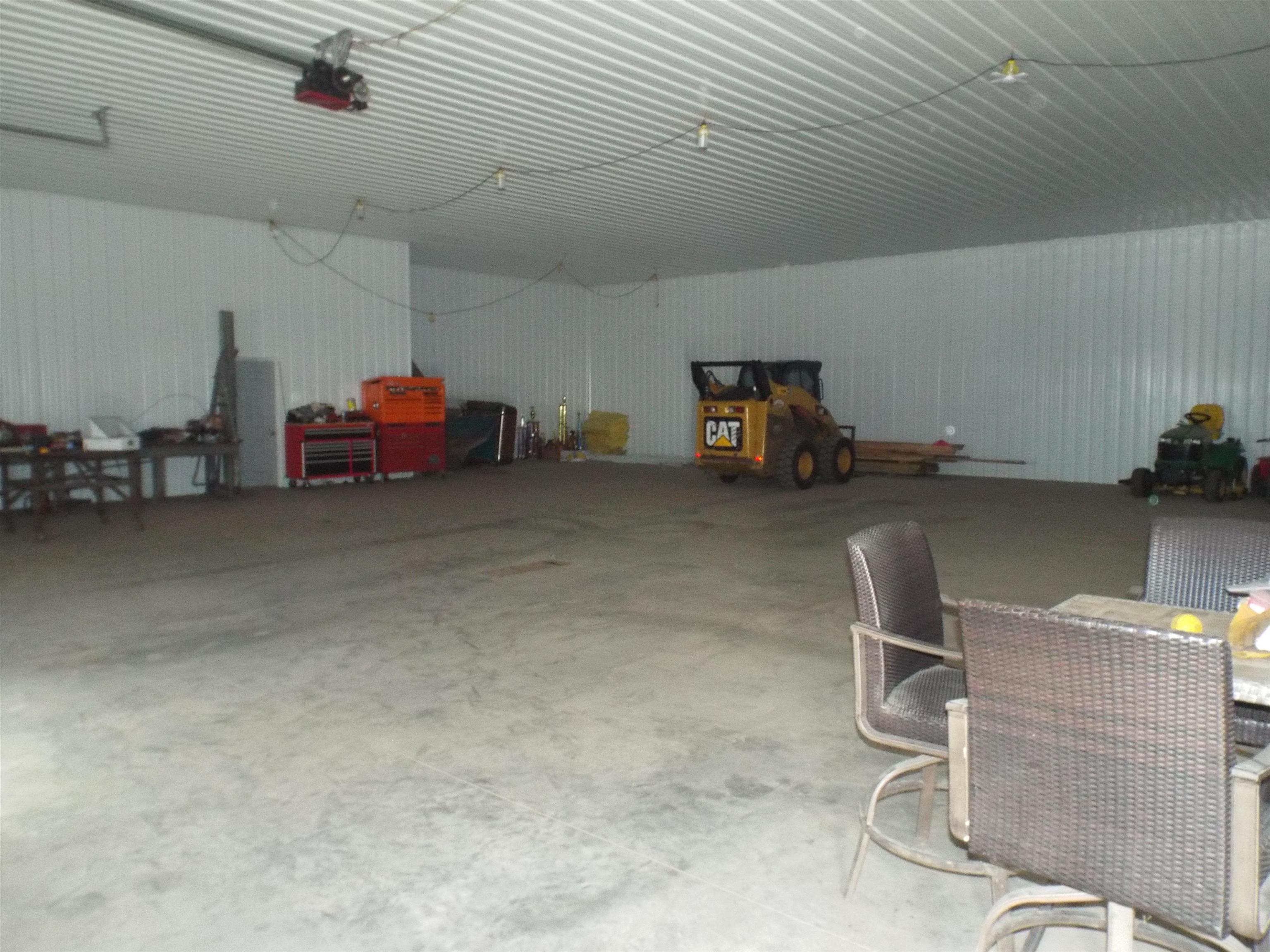 312 East Buckeye Road Dakota, IL 61018 - Photo 29 of 38 a view of a big room with air conditioner duct and materials on floor
