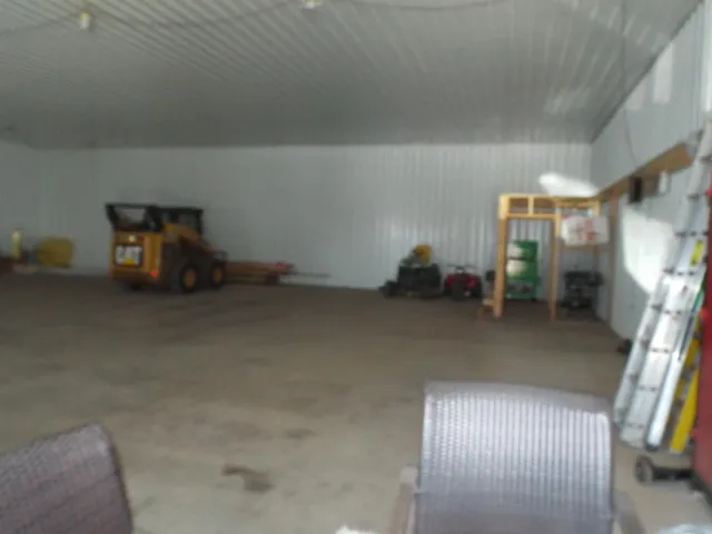 a room with gym equipment and a chandelier