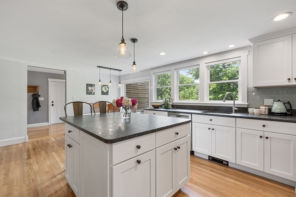 41 Gleasondale Road Stow, MA 01775 - Photo 11 of 42 a kitchen with center island with sink and windows