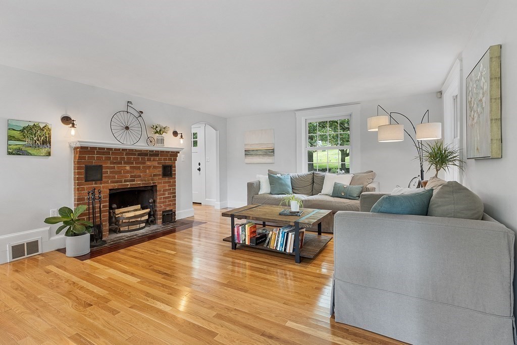 41 Gleasondale Road Stow, MA 01775 - Photo 13 of 42 a living room with furniture a fireplace and a window