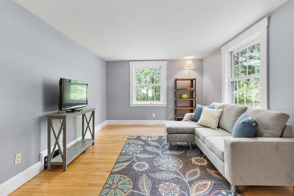 41 Gleasondale Road Stow, MA 01775 - Photo 18 of 42 a living room with furniture and a flat screen tv