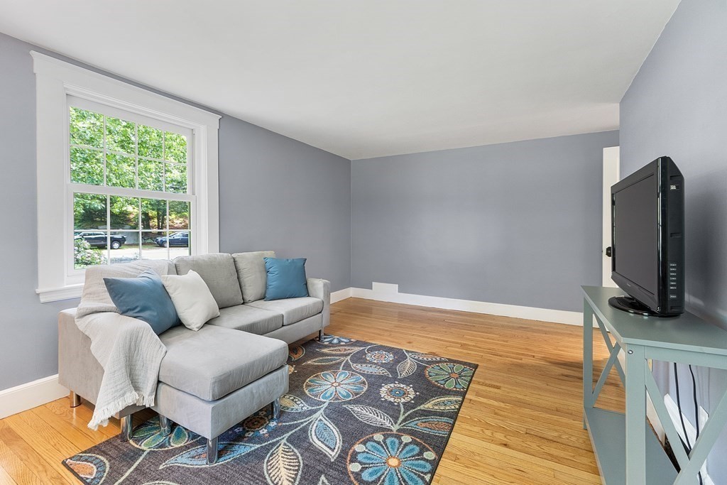 41 Gleasondale Road Stow, MA 01775 - Photo 19 of 42 a living room with furniture and a flat screen tv
