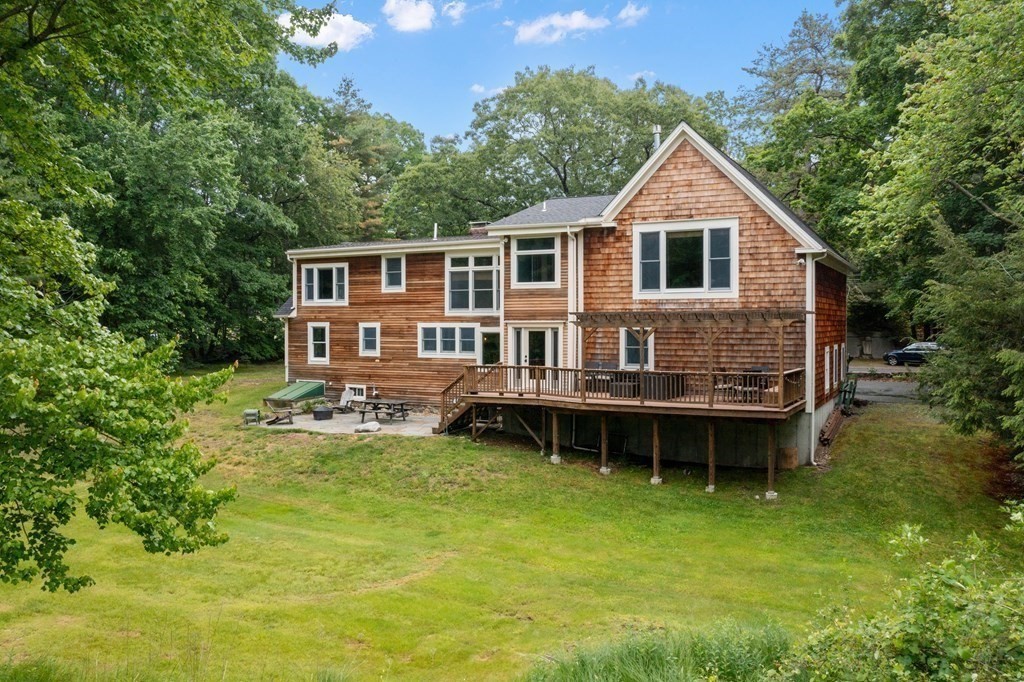 41 Gleasondale Road Stow, MA 01775 - Photo 2 of 42 a view of a house with a yard table and chairs in patio
