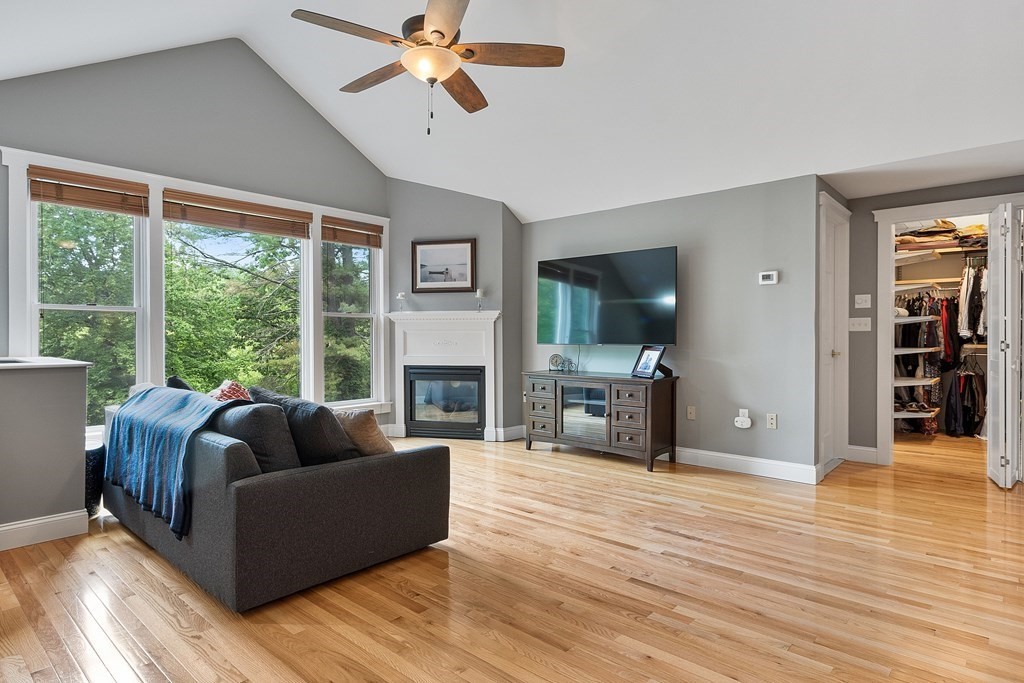 41 Gleasondale Road Stow, MA 01775 - Photo 24 of 42 a living room with furniture flat screen tv and a fireplace