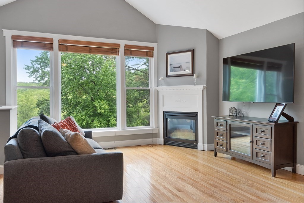 41 Gleasondale Road Stow, MA 01775 - Photo 26 of 42 a living room with furniture and a fireplace