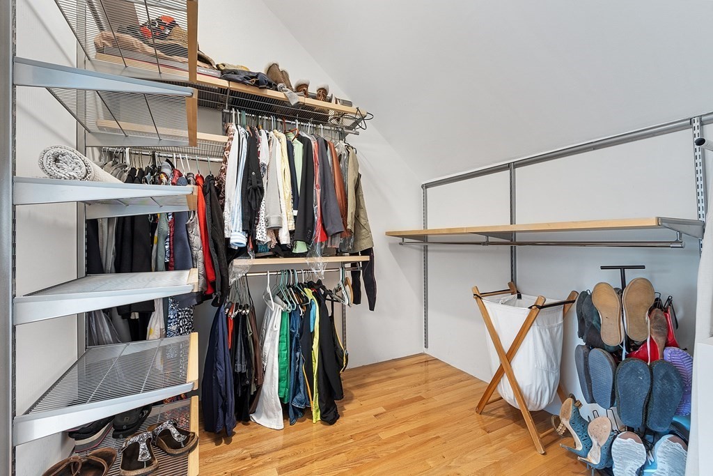 41 Gleasondale Road Stow, MA 01775 - Photo 28 of 42 a view of walk in closet with clothes and shoes