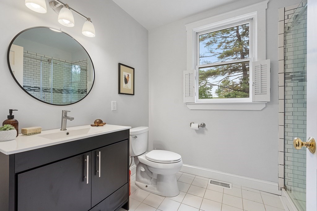 41 Gleasondale Road Stow, MA 01775 - Photo 34 of 42 a bathroom with a toilet a sink and mirror