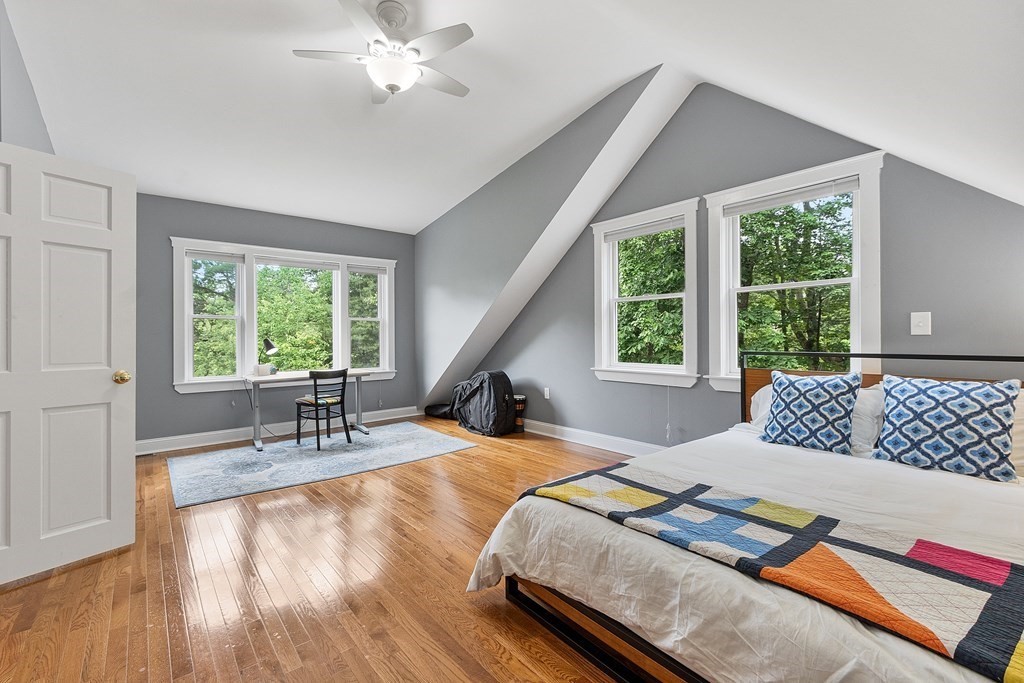 41 Gleasondale Road Stow, MA 01775 - Photo 35 of 42 a bedroom with a bed and a large window with outer view