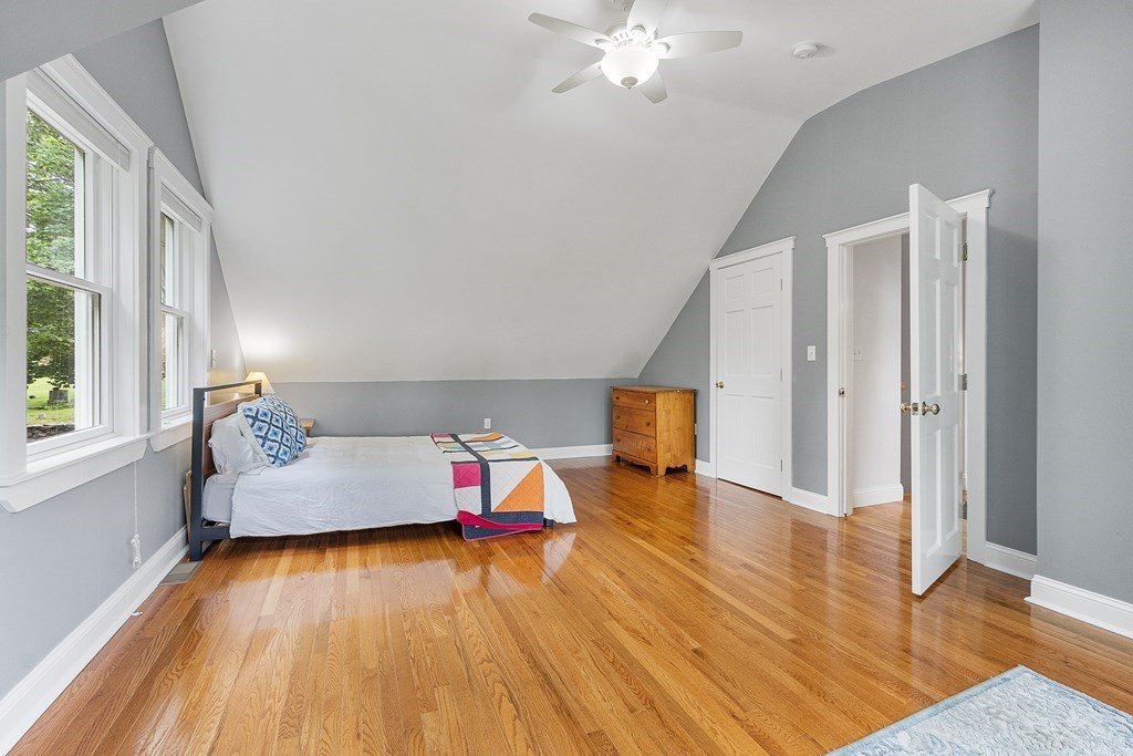 41 Gleasondale Road Stow, MA 01775 - Photo 36 of 42 a living room with furniture and a wooden floor