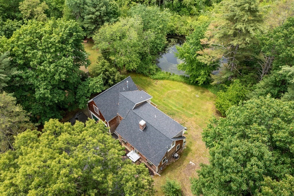 41 Gleasondale Road Stow, MA 01775 - Photo 37 of 42 an aerial view of a house with a yard and swimming pool
