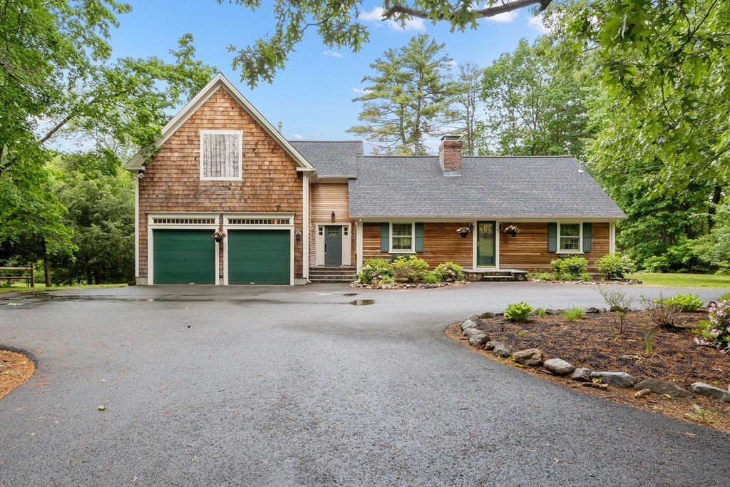 41 Gleasondale Road Stow, MA 01775 - Photo 4 of 42 a front view of a house with a garden and porch