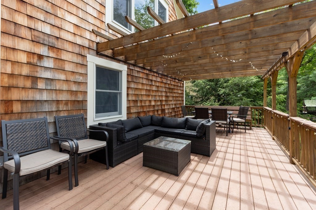 41 Gleasondale Road Stow, MA 01775 - Photo 8 of 42 a balcony with furniture and a potted plant