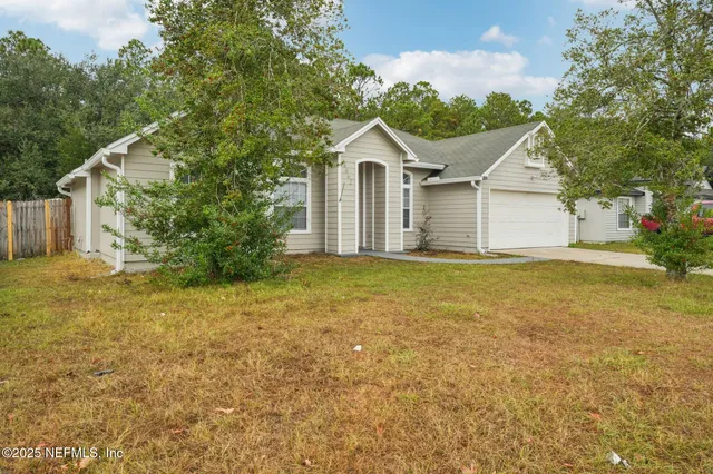 a view of an empty room with glass door