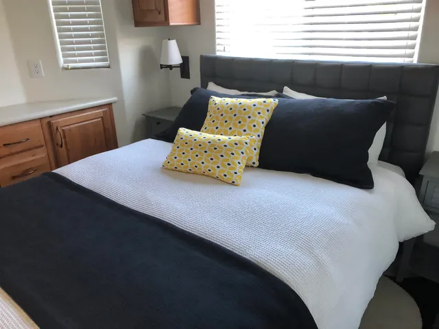 an outdoor sitting area with a table and chairs