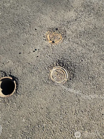 a picture of a bathroom with a white wall