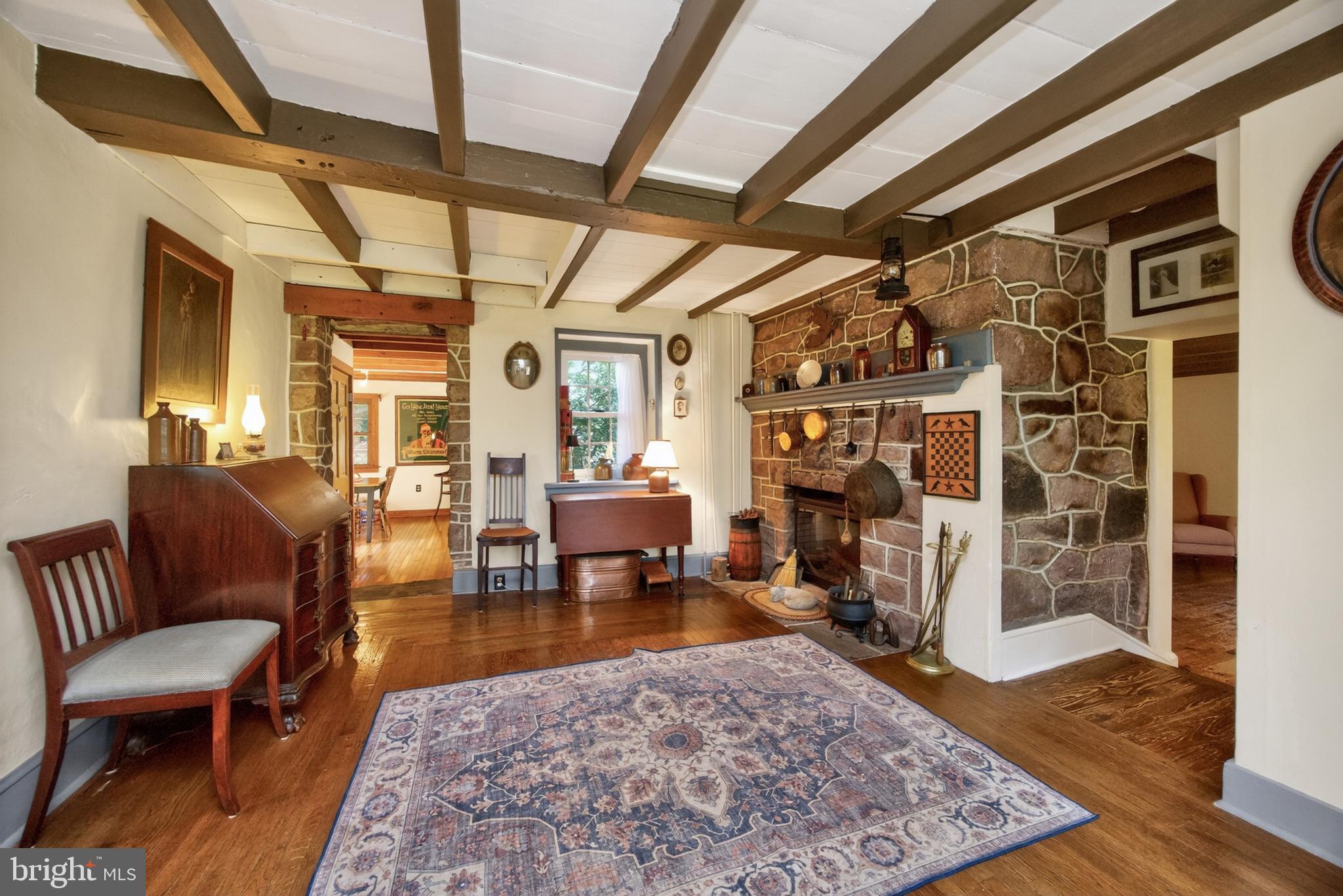 1717 Unionville Road Pottstown, PA 19465 - Photo 10 of 50 Gathering area w/wood flr, beamed ceiling & ele FP