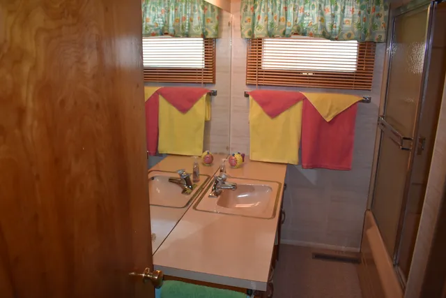 a bathroom with a sink and a mirror