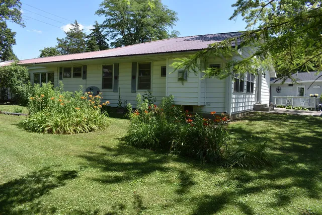 a view of a house with a garden