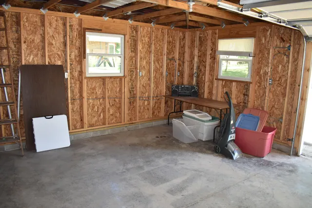 a spacious bathroom with a tub shower and window