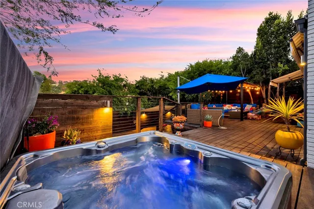 a view of a swimming pool with an outdoor seating