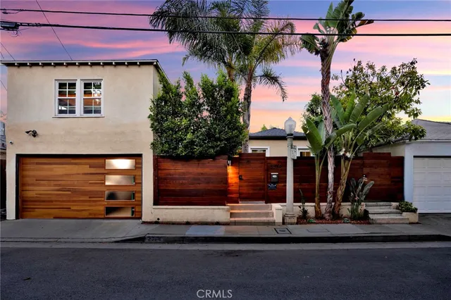 a front view of a house with a street