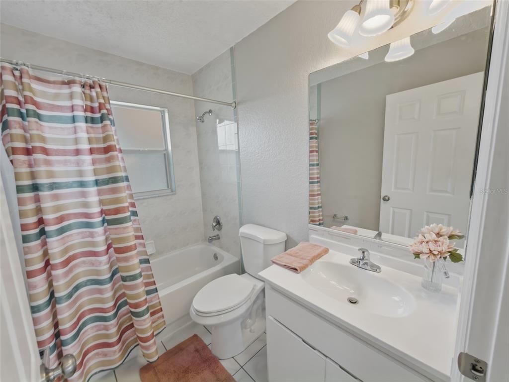 2202 Godfrey Avenue Spring Hill, FL 34609 - Photo 25 of 36 a bathroom with a sink a toilet and shower