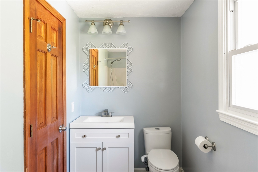 12 Loyola Circle Boston, MA 02132 - Photo 13 of 29 a bathroom with a toilet sink and mirror