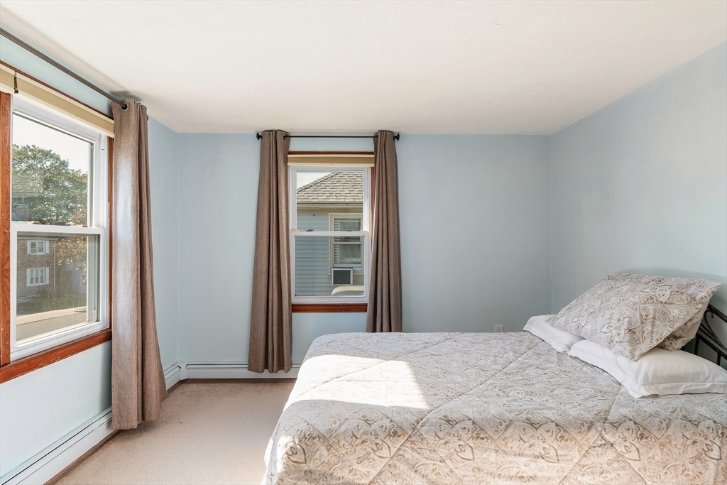12 Loyola Circle Boston, MA 02132 - Photo 15 of 29 a bedroom with a bed and a window
