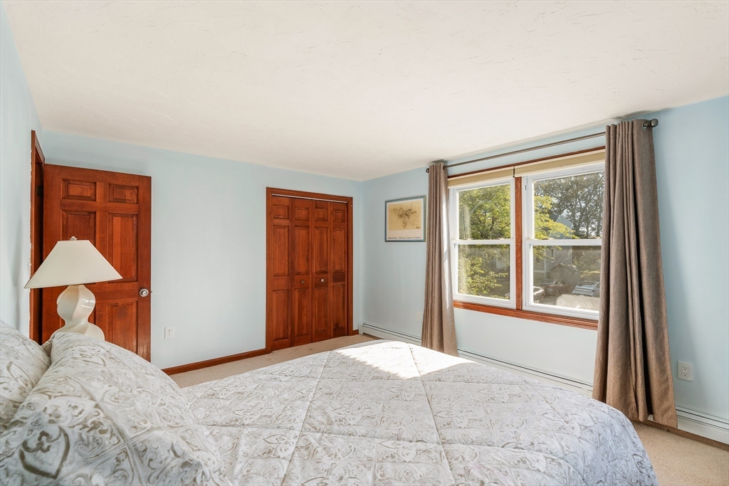 12 Loyola Circle Boston, MA 02132 - Photo 16 of 29 a bedroom with a bed and a window