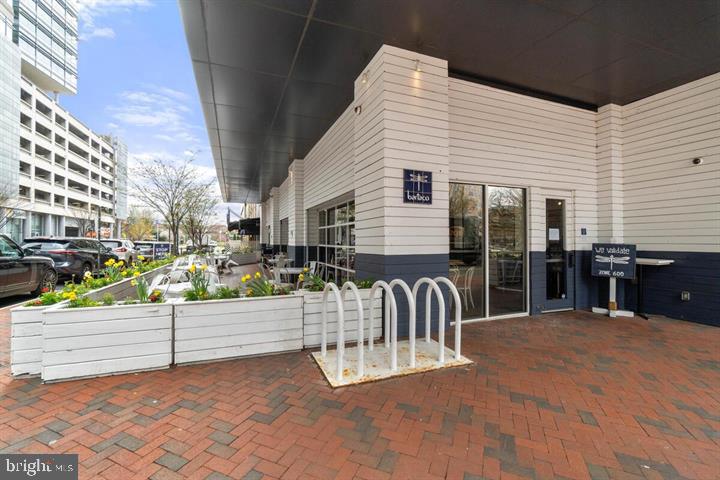 12000 Market Street, Unit 173 Reston, VA 20190 - Photo 17 of 47 Charming urban entrance with greenery.