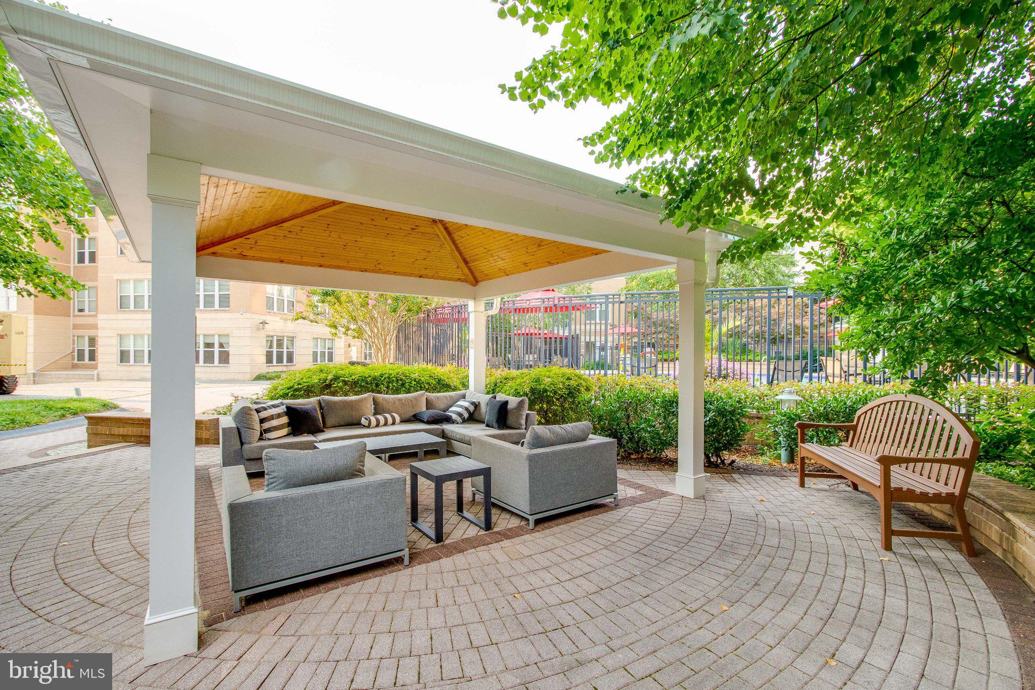 12000 Market Street, Unit 173 Reston, VA 20190 - Photo 47 of 47 Serene outdoor lounge under a canopy.