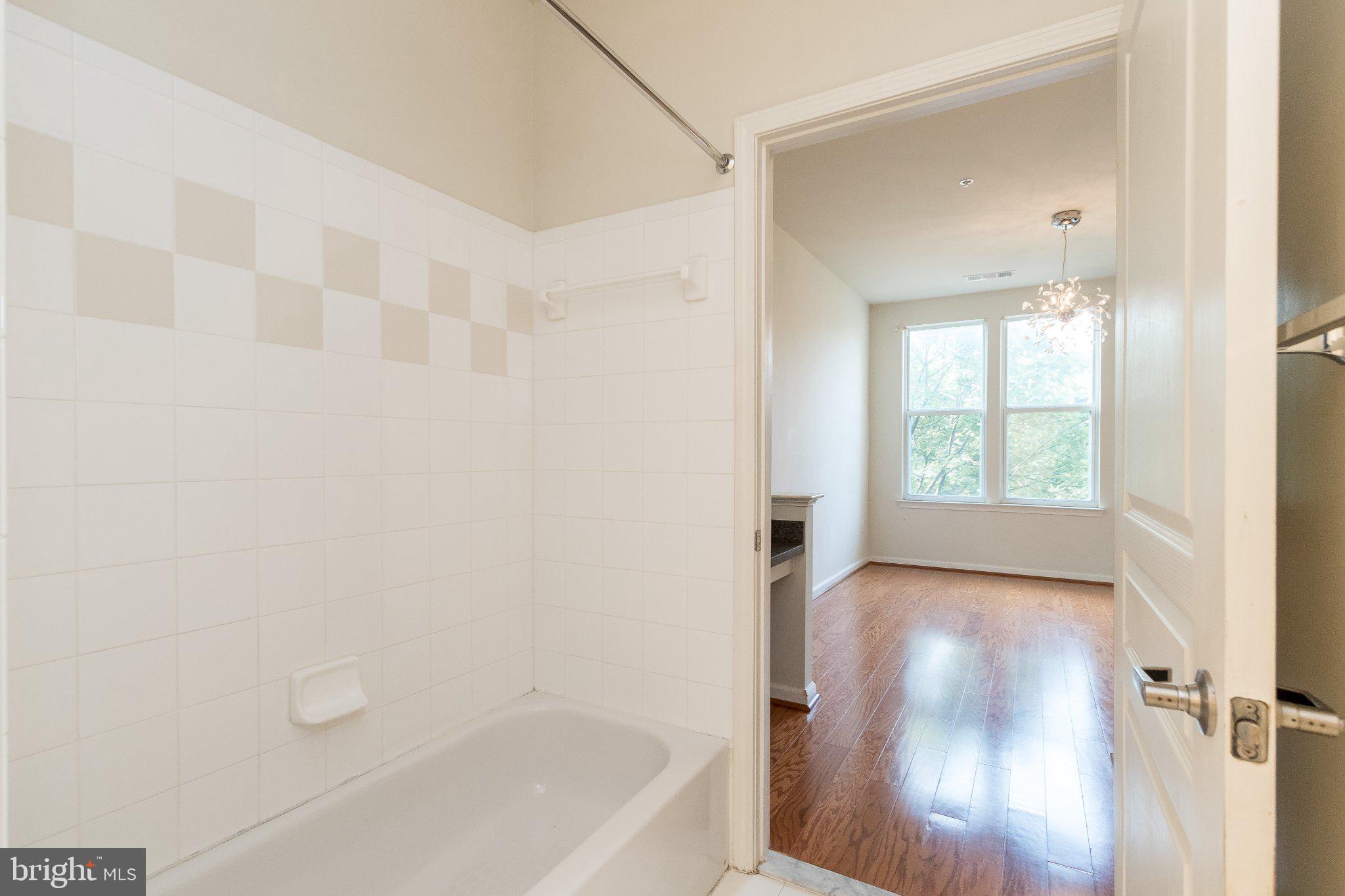 12000 Market Street, Unit 173 Reston, VA 20190 - Photo 10 of 47 Bright and airy bathroom retreat.