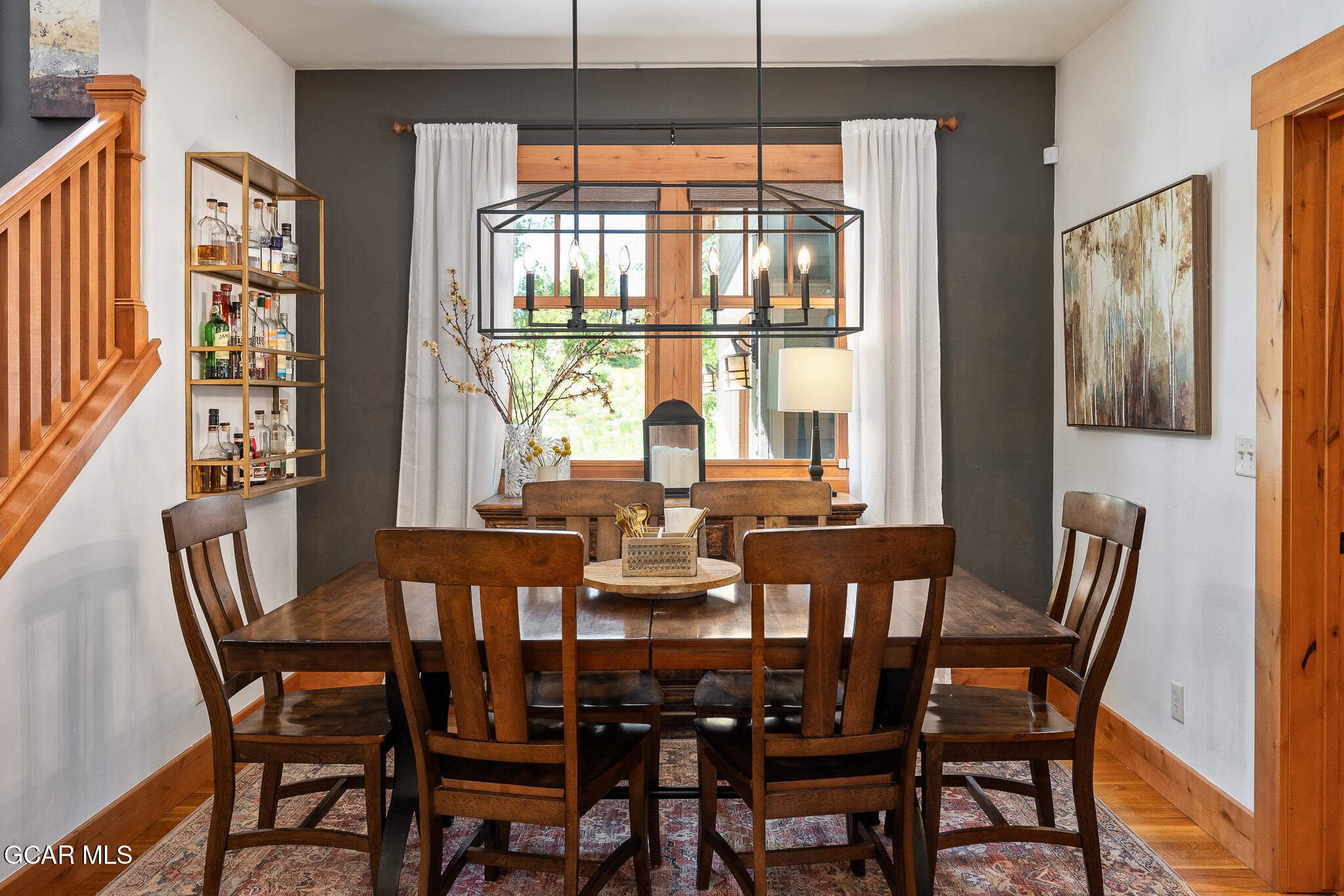 4 Rifle Shot Trail Fraser, CO 80442 - Photo 11 of 47 a view of a dining room with furniture large windows and wooden floor