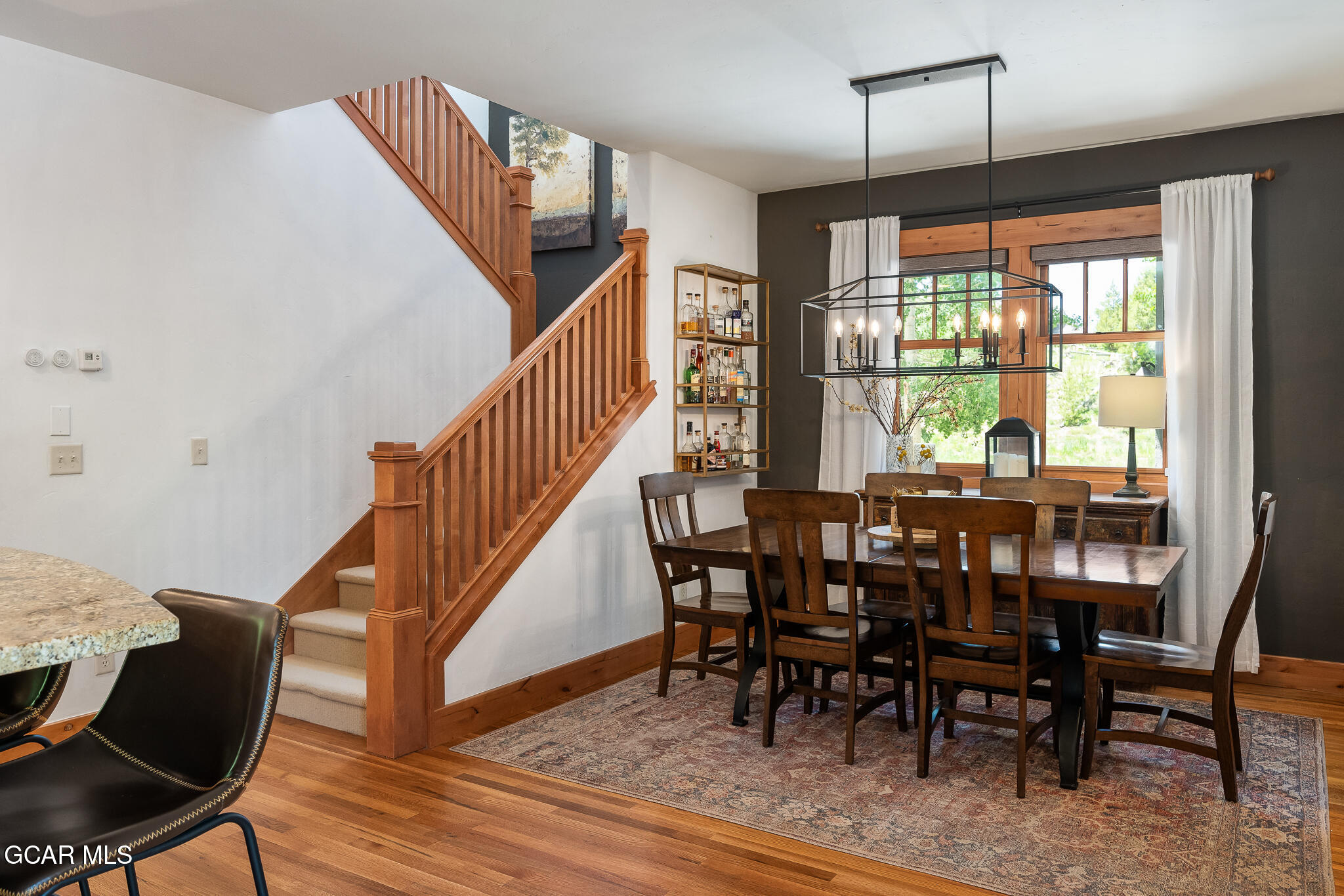 4 Rifle Shot Trail Fraser, CO 80442 - Photo 12 of 47 a view of a dining room with furniture window and wooden floor