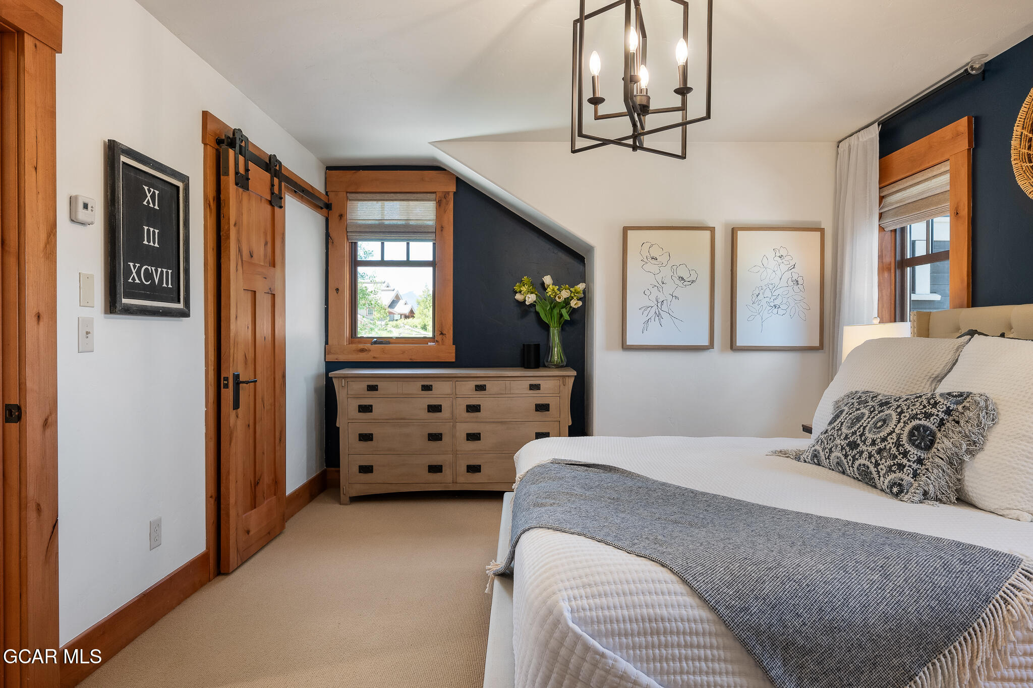 4 Rifle Shot Trail Fraser, CO 80442 - Photo 16 of 47 a bedroom with a bed mirror and furniture