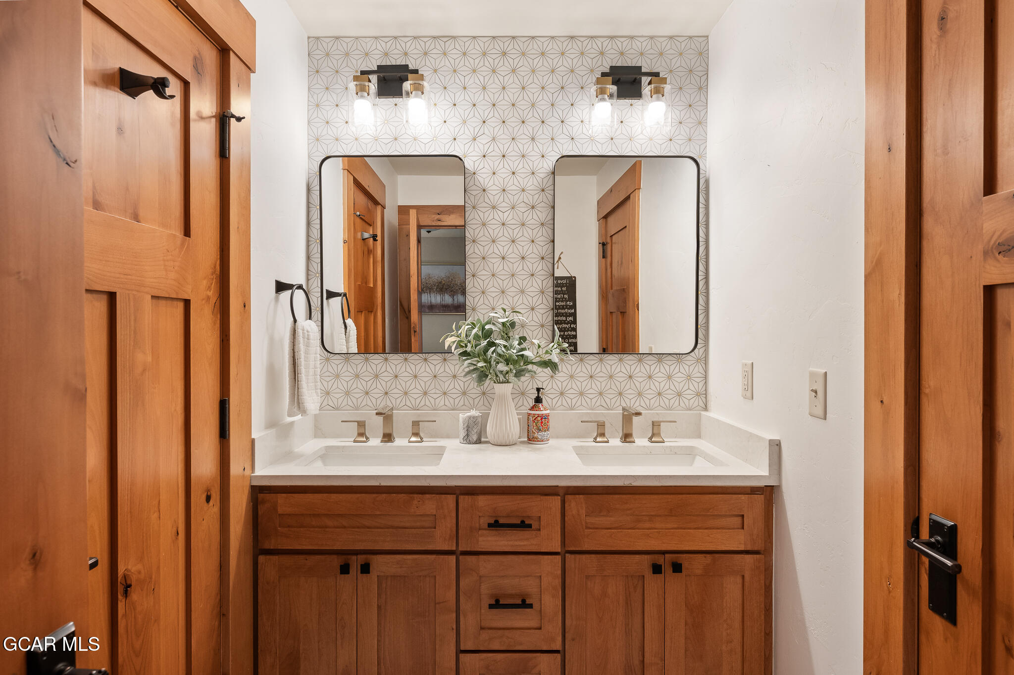4 Rifle Shot Trail Fraser, CO 80442 - Photo 19 of 47 a bathroom with double vanity sinks and a mirror