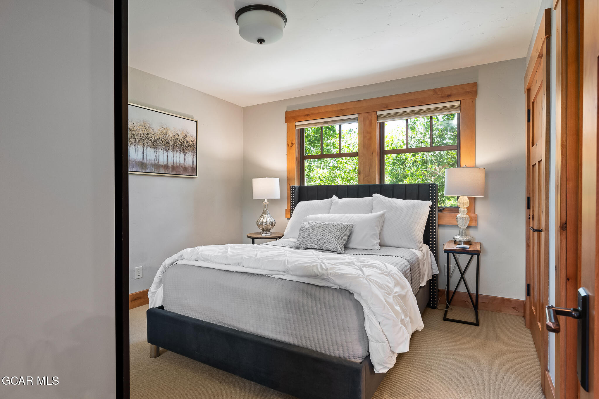 4 Rifle Shot Trail Fraser, CO 80442 - Photo 21 of 47 a bedroom with a bed and wooden floor