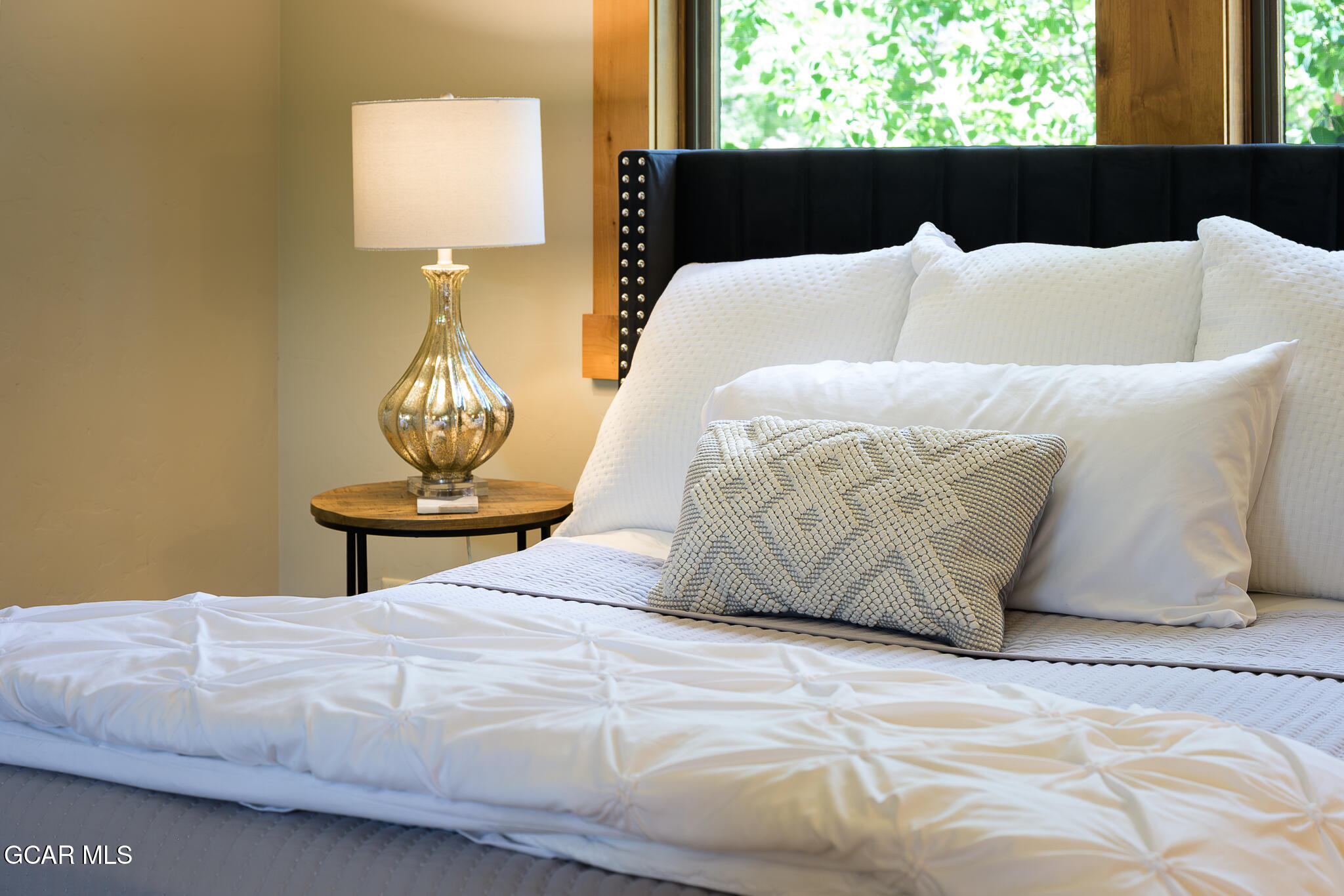 4 Rifle Shot Trail Fraser, CO 80442 - Photo 22 of 47 a bedroom with a bed and window