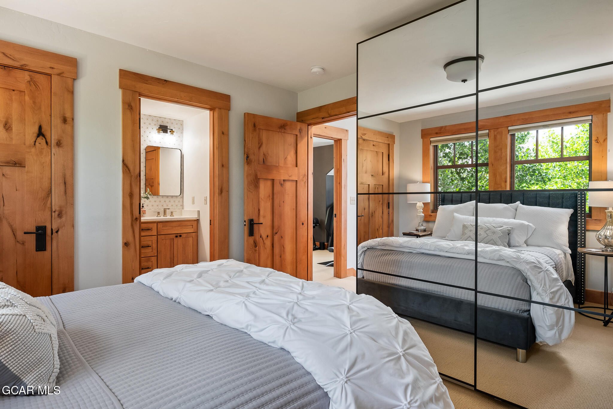 4 Rifle Shot Trail Fraser, CO 80442 - Photo 23 of 47 a bedroom with a large bed and a window