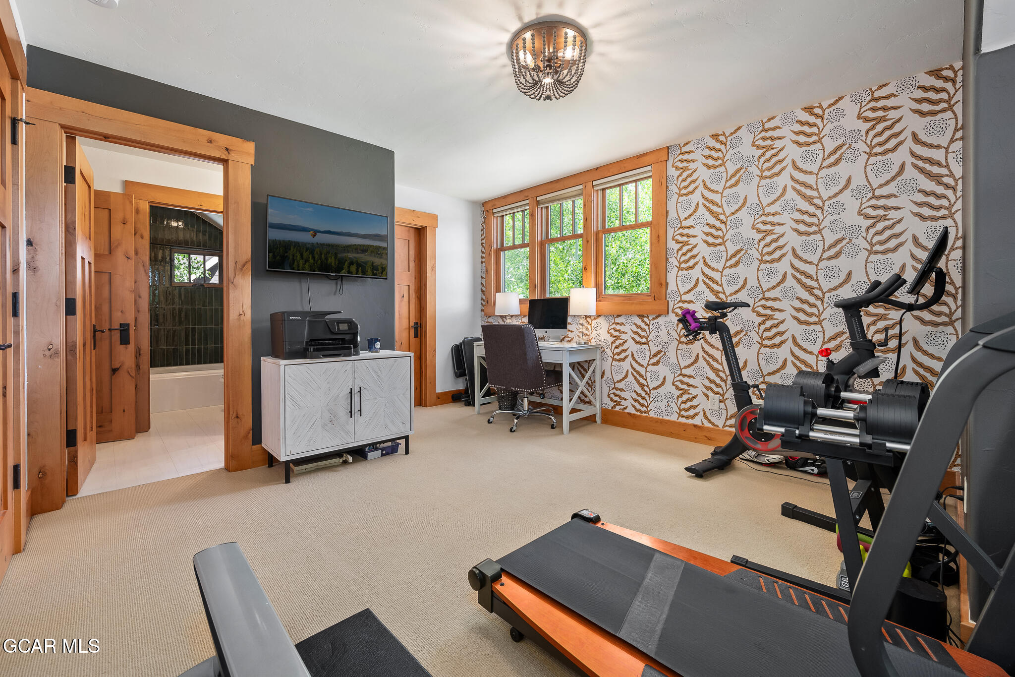 4 Rifle Shot Trail Fraser, CO 80442 - Photo 25 of 47 a room with gym equipment and a large window