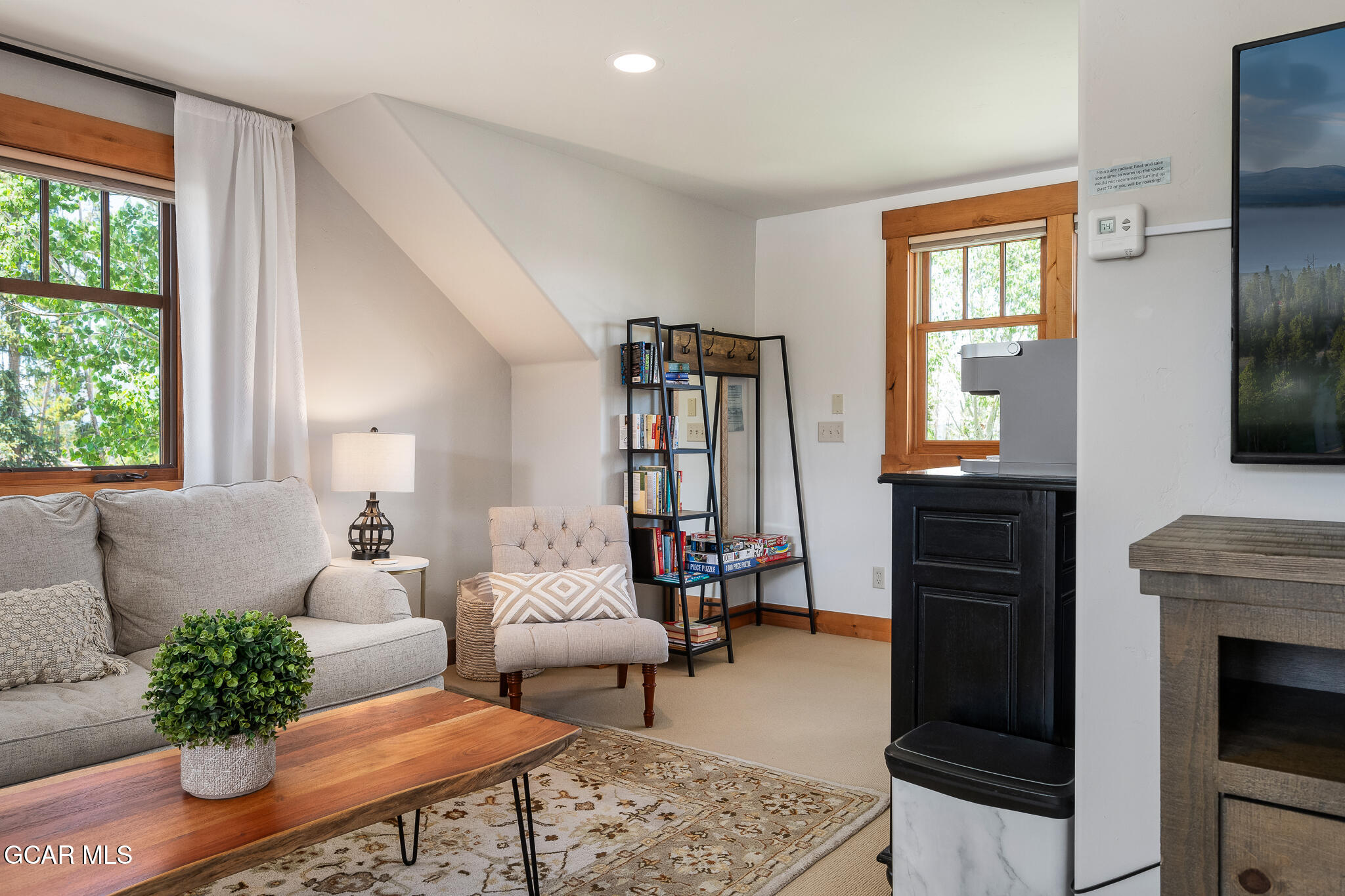 4 Rifle Shot Trail Fraser, CO 80442 - Photo 28 of 47 a living room with furniture fireplace and window