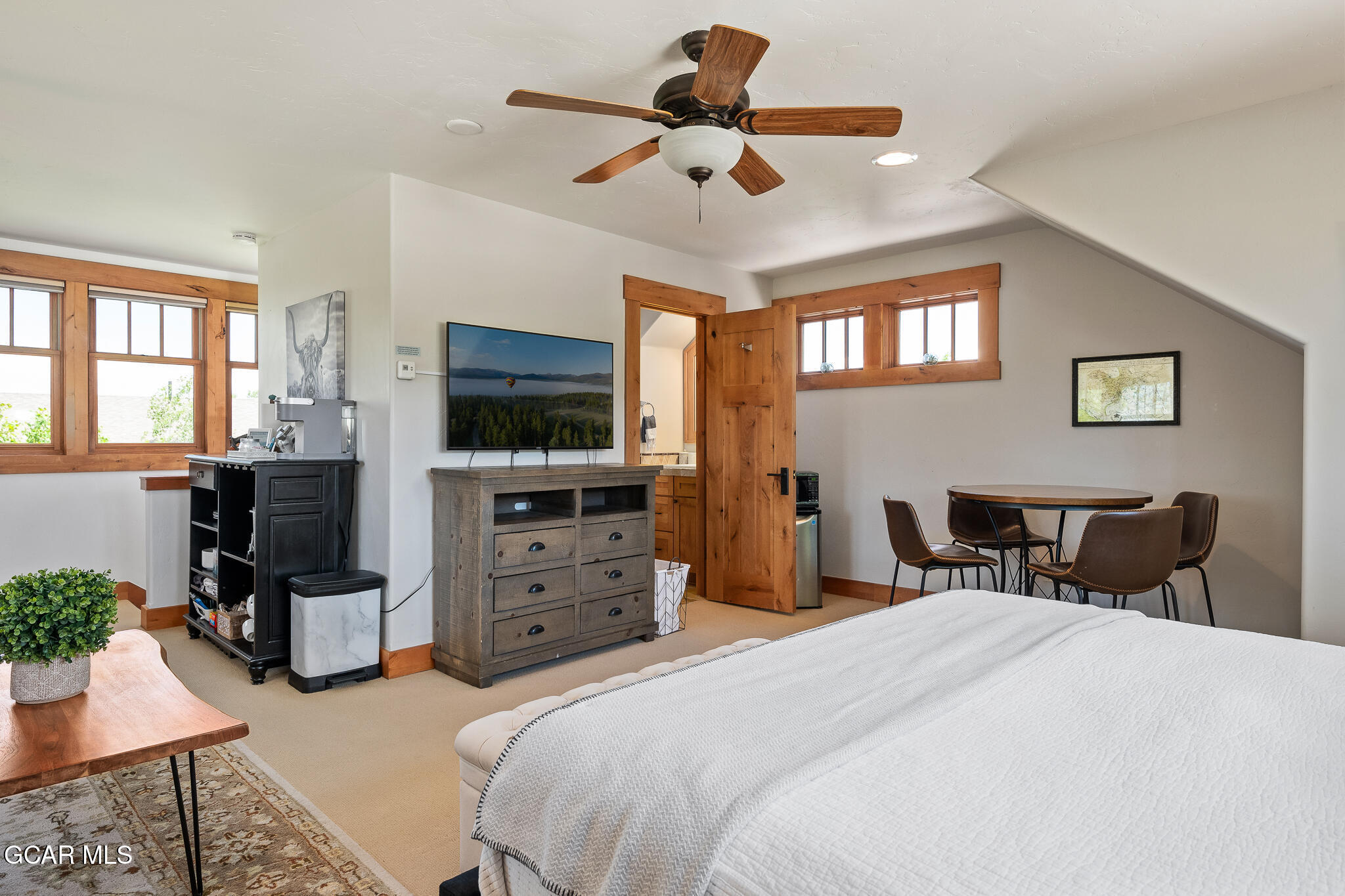 4 Rifle Shot Trail Fraser, CO 80442 - Photo 29 of 47 a bedroom with a bed and a flat screen tv