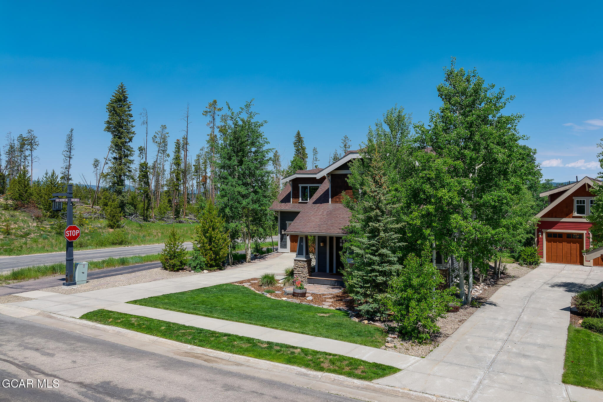 4 Rifle Shot Trail Fraser, CO 80442 - Photo 39 of 47 a front view of a house with a yard and tree s